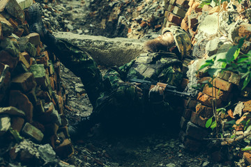 Soldier in the barricade with the gun