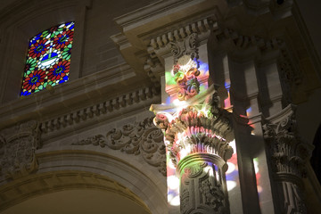 Colorful reflections from a stained glass window, El Salvador church, Seville, Spain