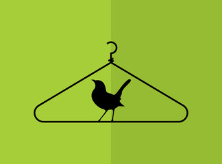 creative concept of bird and hanger