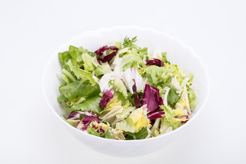  Green and red leaf of lettuce . Isolated on a white background