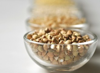 Raw buckwheat groats in a bowl, closeup