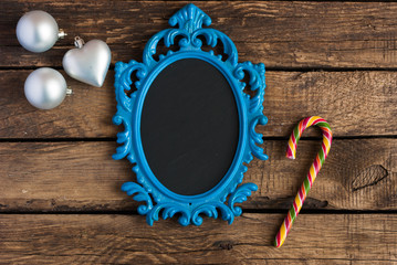 Christmas wooden background with blue frame