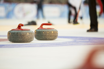 Curling stones on ice
