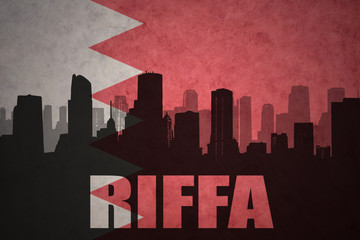 abstract silhouette of the city with text Riffa at the vintage bahrain flag background