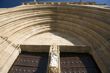 Low angle view of the ogival doorway of Caceres Cathedral, Spain