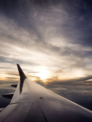 Fototapeta na wymiar Airplane travel time is sunset