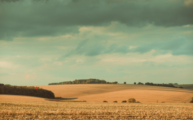 fall season fields and hills on sunset