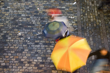 Aerial view of people under umbrellas on a rainy day, Seville, Spain