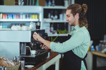 Fototapeta na wymiar Waiter making cup of coffee
