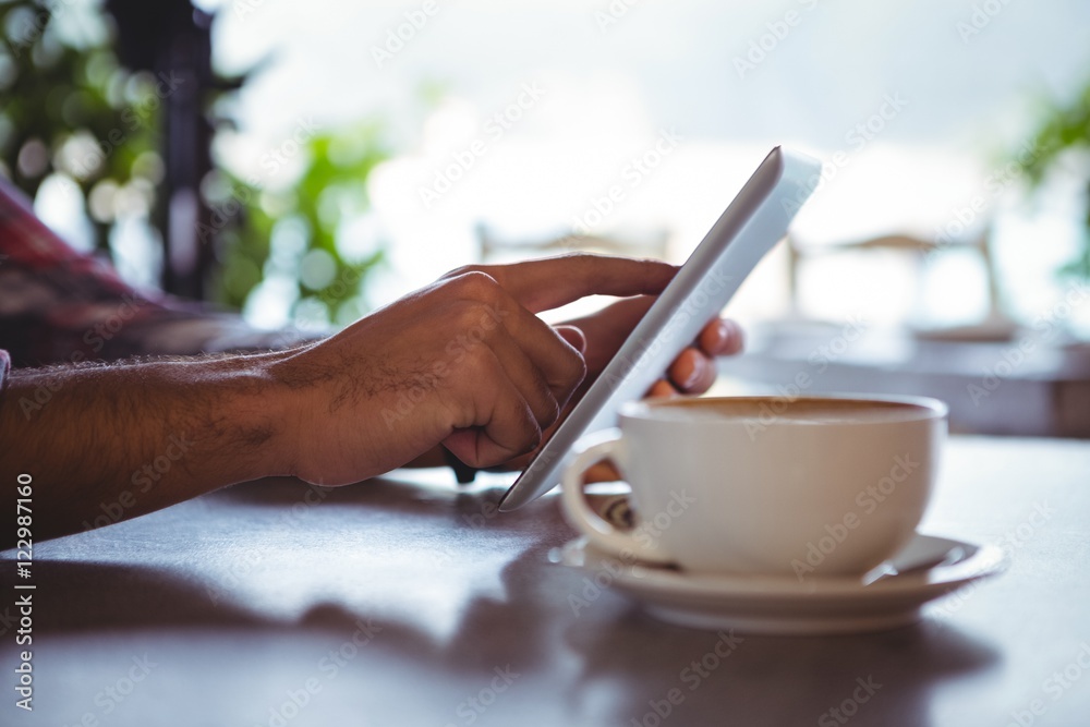 Poster hands of man using digital tablet