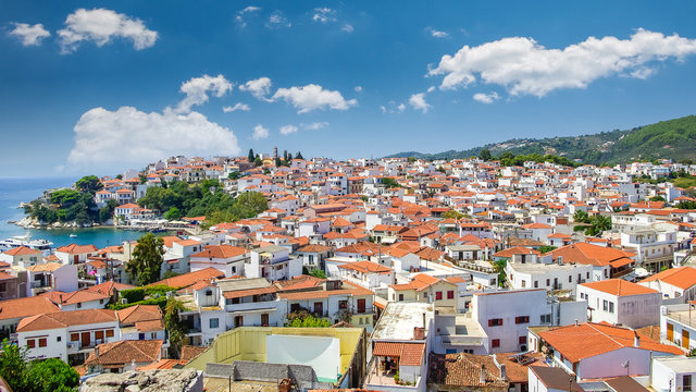 Skiathos town on Skiathos Island, Greece. Beautiful view of the old town with boats in the harbor.