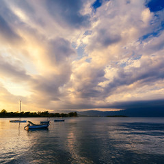 Fototapeta na wymiar Sunset with fishing boats. Corfu. Greece