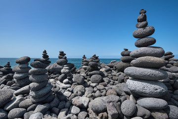 Huge amount of zen stones piled in the beach, Puerto de la Cruz,