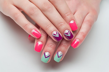 multicolored manicure pink, mint, green, purple moon with crystals and stripes 