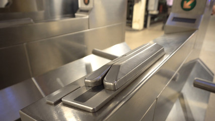 Close up of a New York subway metrocard swipe at the security turnstile to enter the underground...