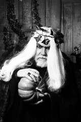 Old man in costume of sorcerer