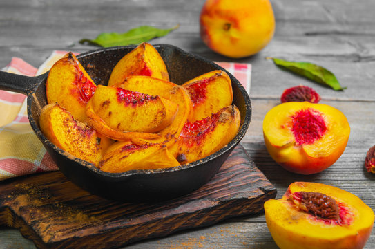 Baked peaches on a cast iron pan