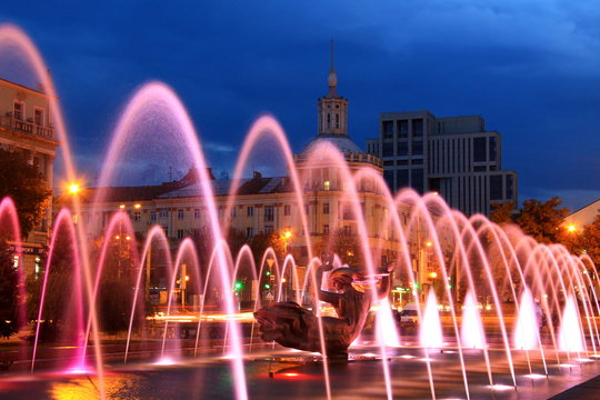 Beautiful multi-colored fountain near the Opera House in the city Dnepr at night (Dnepropetrovsk).Ukraine