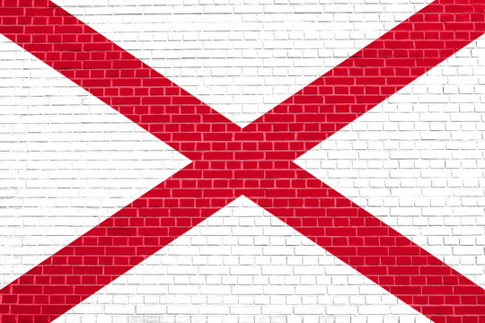 Flag of Alabama on brick wall texture background
