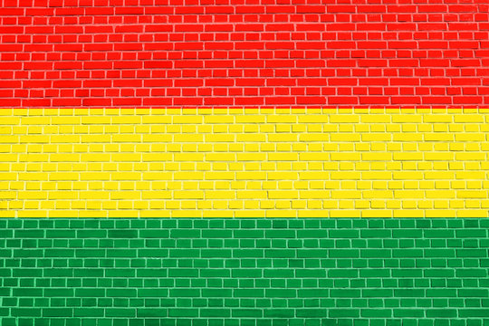 Flag of Bolivia on brick wall texture background