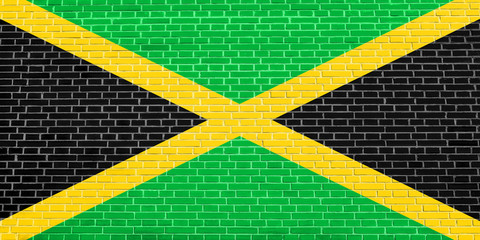 Flag of Jamaica on brick wall texture background