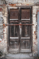 Old weathered door with latch