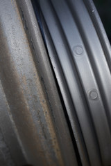 before and after - metal wheel rim now ready for electroplating after being blasted with metal balls