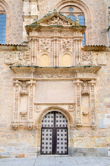 Fototapeta na wymiar SALAMANCA, SPAIN, APRIL - 17, 2016: The plateresque - gothic portal of church Iglesia de Sancti Spiritus from 16. cent. with the medailons of st. Peter and Paul and storys of Petrarca in the reliefs.