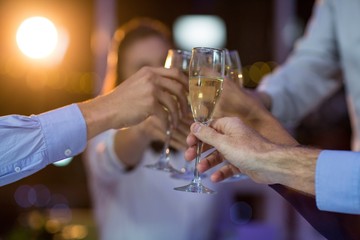 Group of businesspeople toasting glasses of champagne © WavebreakMediaMicro