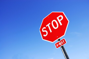 stop sign against blue sky