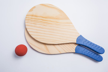Beach tennis, beach paddle ball, matkot. Beach rackets and ball, overhead view.