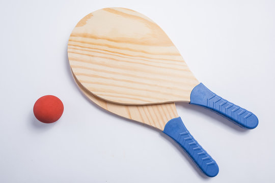 Beach tennis, beach paddle ball, matkot. Beach rackets and ball, overhead view.