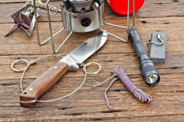 Equipment for camping on a wooden floor background