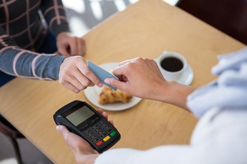 Customer giving credit card to waiter