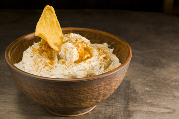 Hummus in an earthenware dish