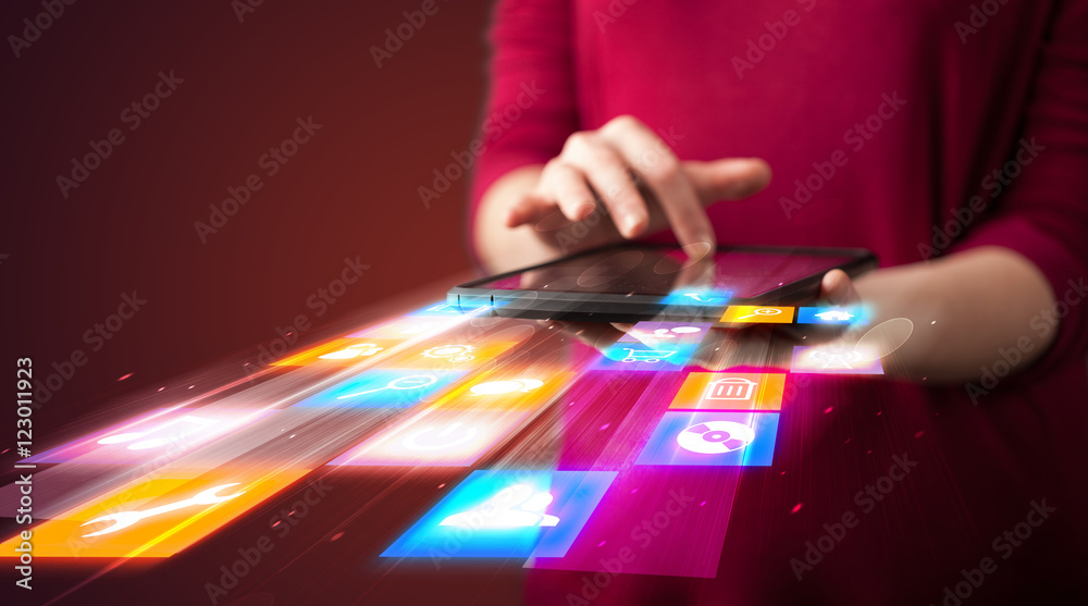Poster hand holding tablet device with media application