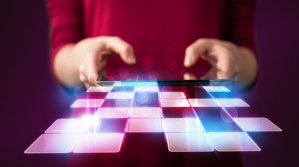 Fototapeta premium Close up of hand holding tablet with cyber application