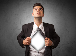 Businessman tearing off his shirt with white copyspace on chest