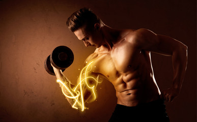 Muscular body builder lifting weight with energy lights on bicep