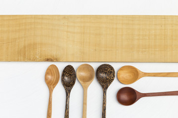 Wooden spoon design and wooden sign on white background