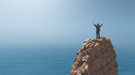 Man standing on top of a rock cliff