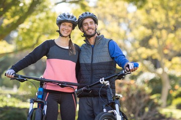 Fototapeta na wymiar Biker couple with mountain bike in countryside