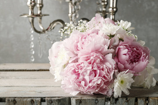 Floral arrangement with pink peonies