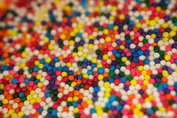 Fototapeta na wymiar blur colorful sprinkles chocolate rice balls background