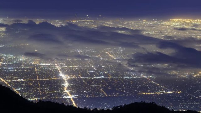 Time lapse of aerial view of foggy Los Angeles city lights shot from Mt. Wilson, California -Long Shot-