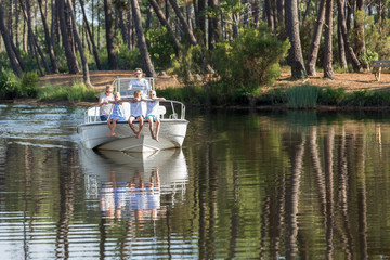 family enjoying a summer day on a boat