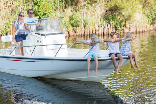 Family Hanging Out Together In A Boat