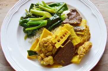 spicy chicken with bamboo shoot curry and stir fried Chinese kale on rice
