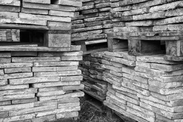  Stack of vintage clay brick on pallet (Black and White).