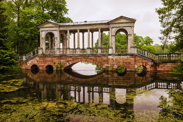 Fototapeta na wymiar The bridge in the park of Tsarskoye Selo. St. Petersburg, Russia